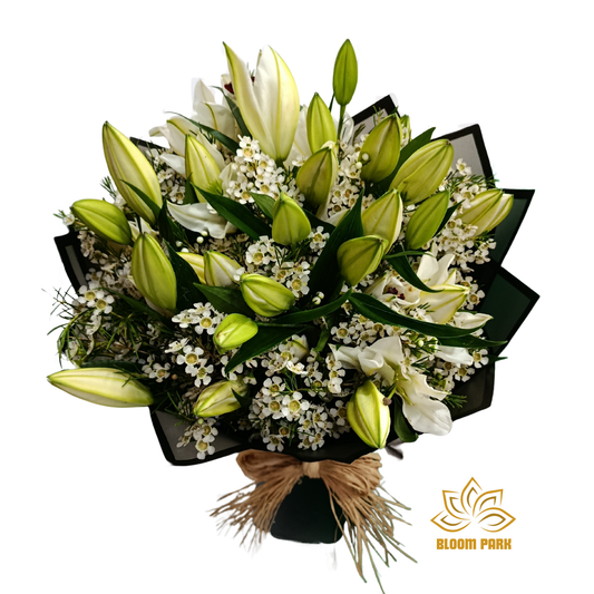 Bouquet of green and white flowers with a decorative bow.