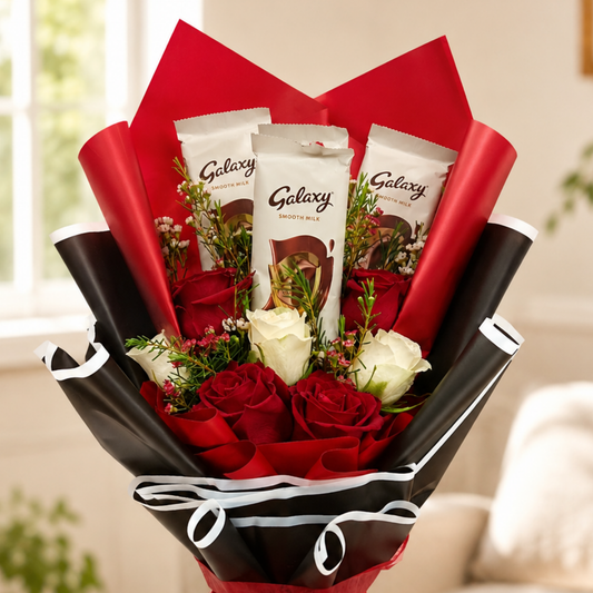 Luxury rose and chocolate bouquet with red roses, white roses, Galaxy chocolate bars, and bold black and red wrapping. flower bouquet, chocolate bouquet.