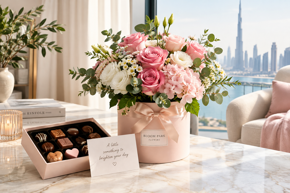 Luxury pink rose gift box with chocolates on a marble table in Dubai