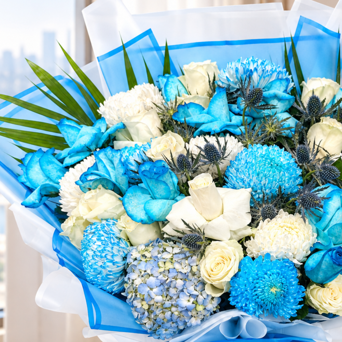 Fresh flower Blue and white mixed flower bouquet with roses, chrysanthemums, hydrangeas, and blue wrapping.