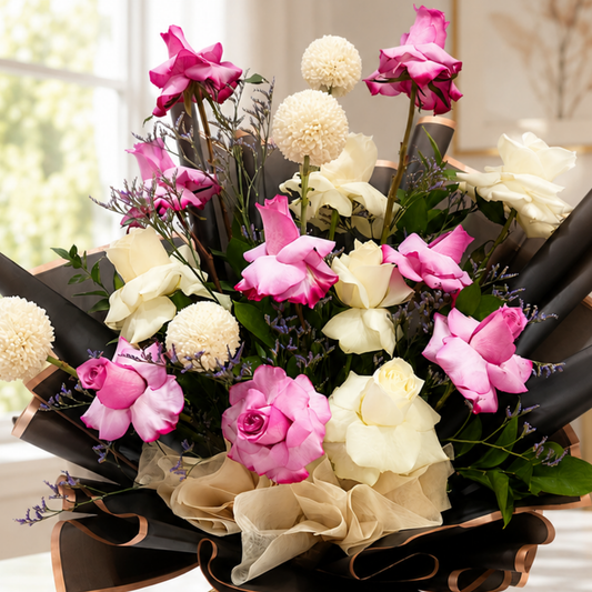 Elegant pink and cream rose bouquet in black wrapping with rose-gold trim and gold ribbon. Flower Bouquet, flower delivery Dubai, Flower Online, Fresh Flower.
