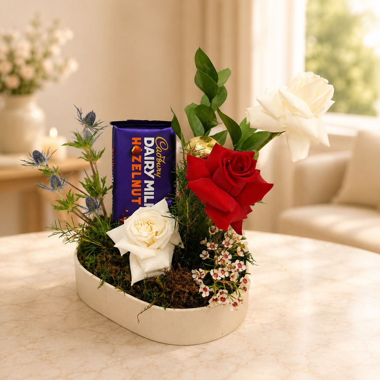 Floral arrangement with a red rose, white flowers, and a chocolate bar. Chocolate and Flowers arrangement