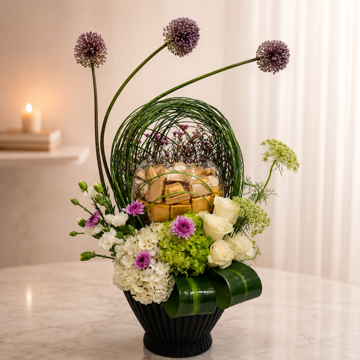 Elegant chocolate floral arrangement with white flowers, purple alliums and black vase, delivery Dubai.