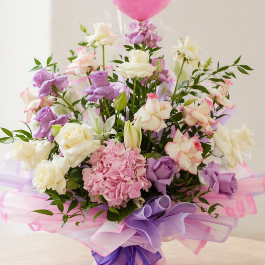 flower bouquet with pink and white roses, hydrangea, and balloons in elegant wrapping