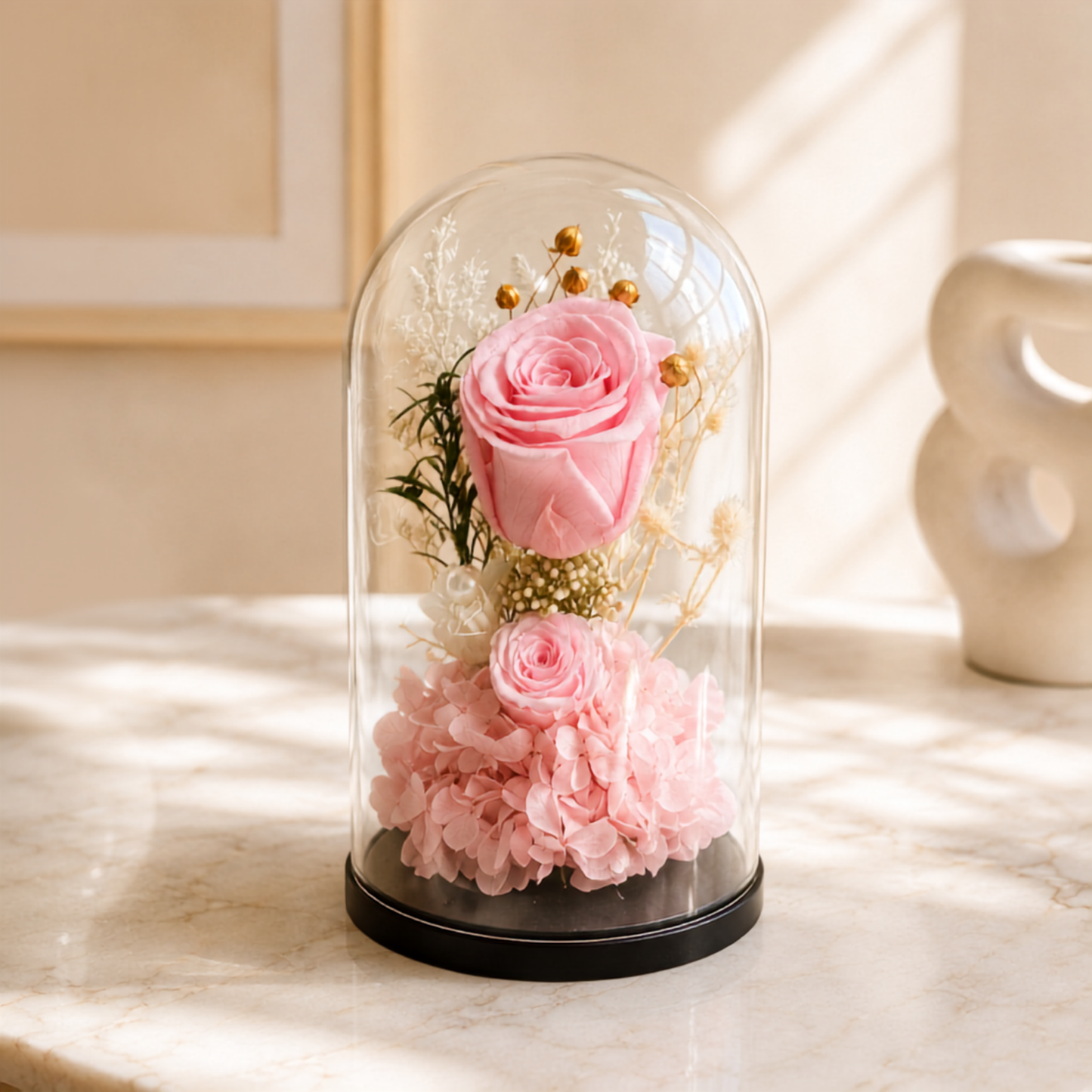 Pink roses in big and small sizes cover in transparent glass dome delivery all over UAE, preserved flowers delivery Dubai.