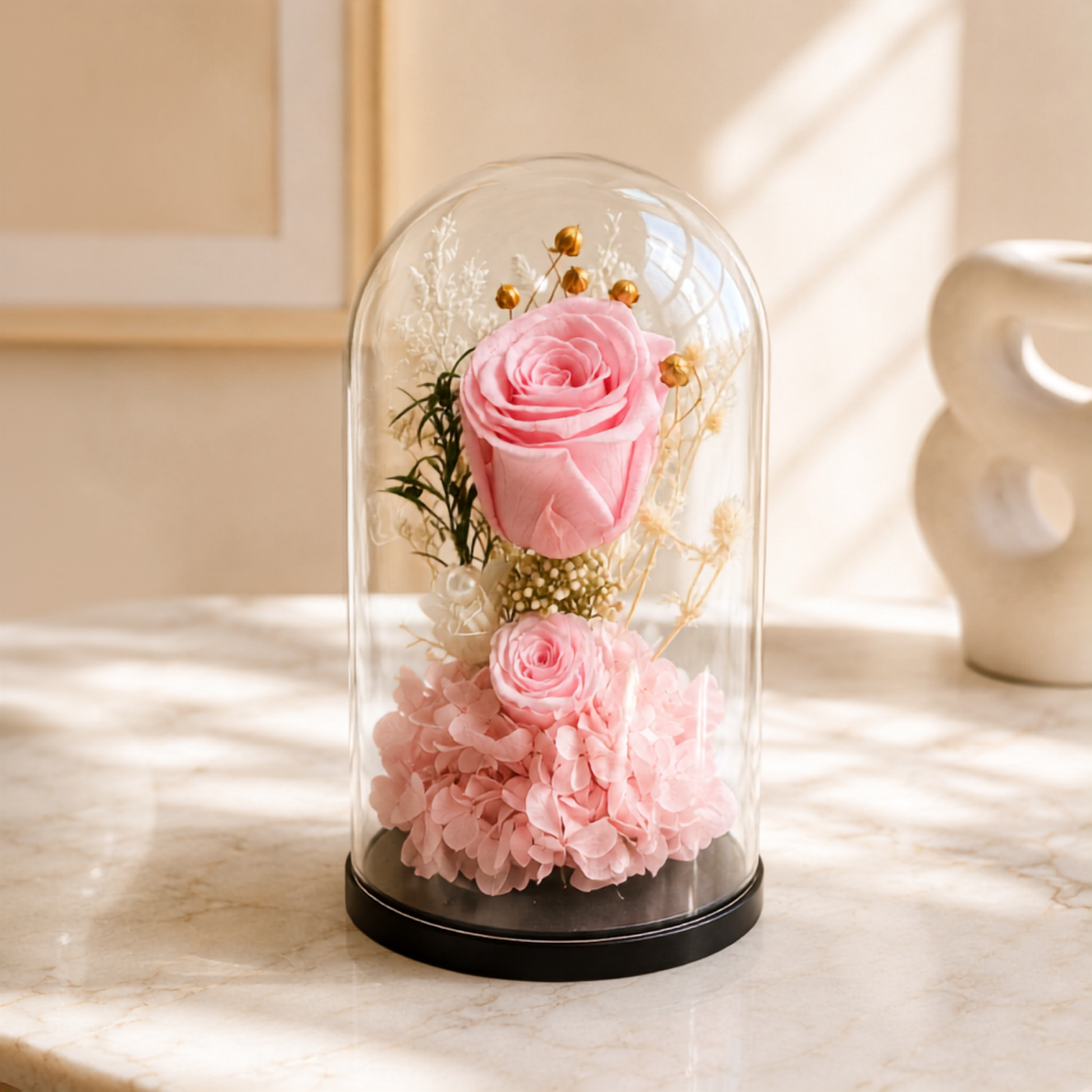 Pink roses in big and small sizes cover in transparent glass dome delivery all over UAE, preserved flowers delivery Dubai.