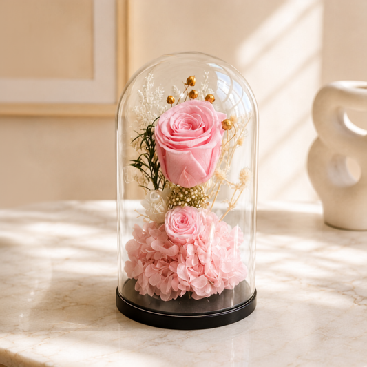 Pink roses in big and small sizes cover in transparent glass dome delivery all over UAE, preserved flowers delivery Dubai.