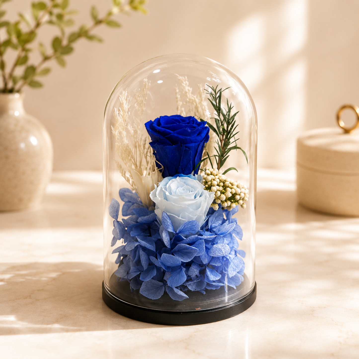 Decorative glass dome with blue flowers, preserved rose delivery Dubai, forever rose.