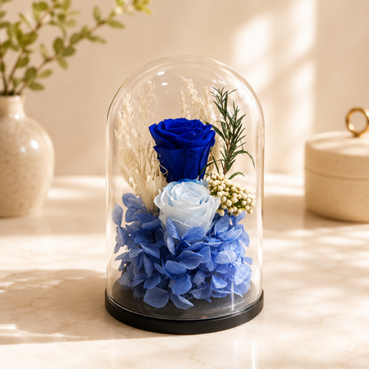 Decorative glass dome with blue flowers, preserved rose delivery Dubai, forever rose.