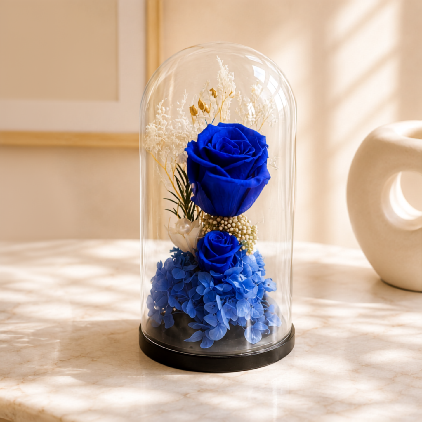 Blue roses in a glass dome, perfect for gifting purpose.