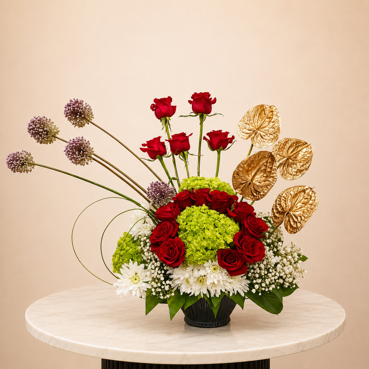 A floral arrangement featuring red roses, green hydrangeas, white daisies, purple allium spikes, and gold anthuriums in a black vase, online flowers arrangement delivery all over UAE
