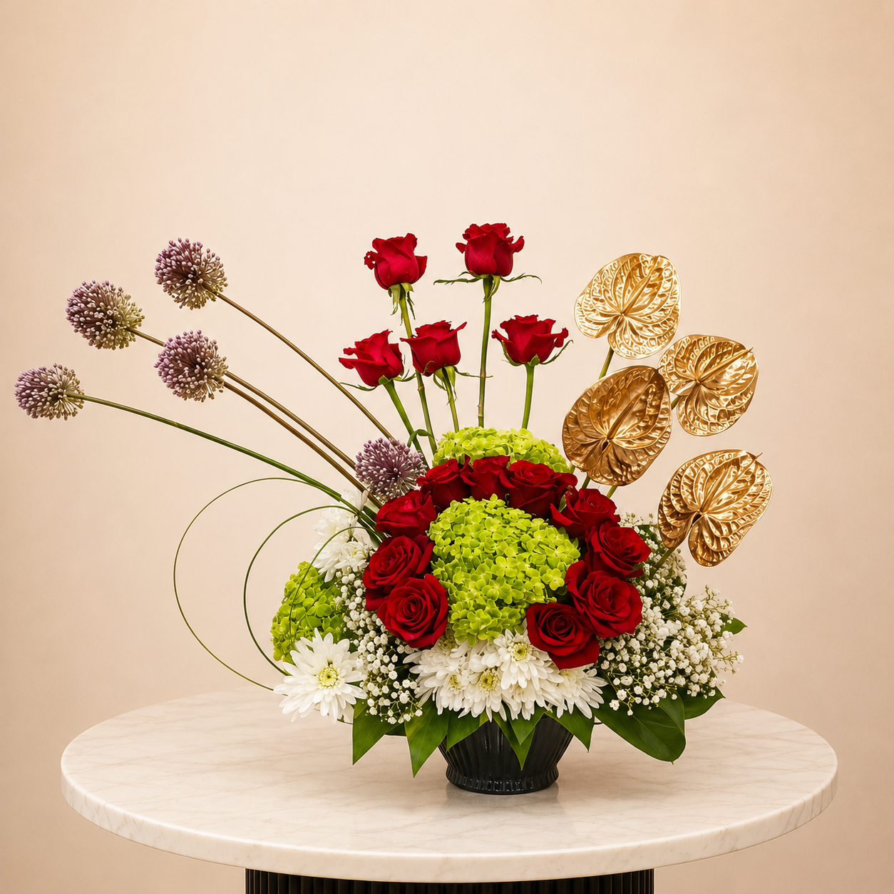 A floral arrangement featuring red roses, green hydrangeas, white daisies, purple allium spikes, and gold anthuriums in a black vase, online flowers arrangement delivery all over UAE