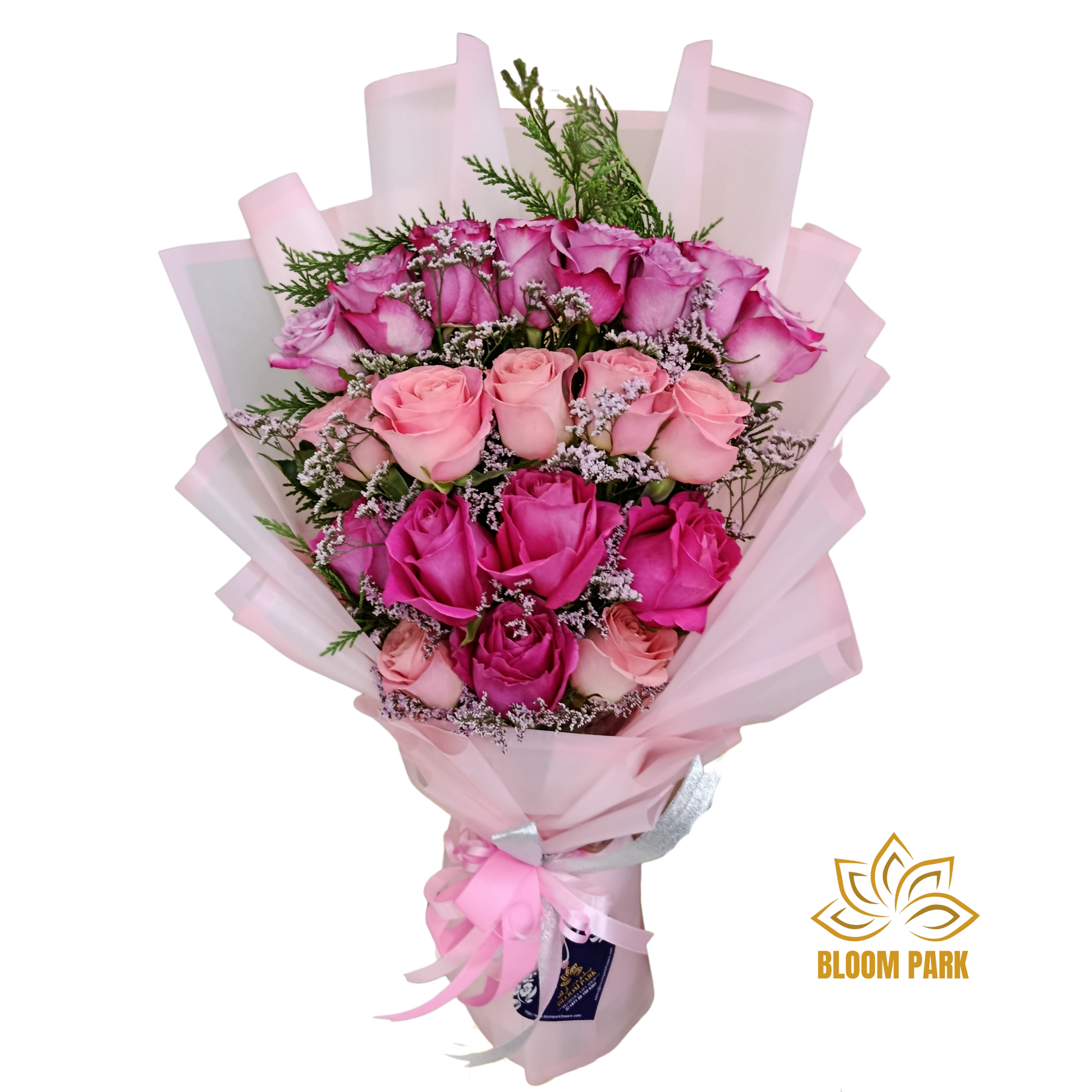 Bouquet of pink and red roses with greenery, wrapped in pink paper, flowers delivery Dubai.