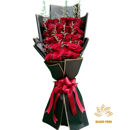 Bouquet of red roses wrapped in black paper with a red ribbon, flower shop in Deira, red rose delivery Dubai