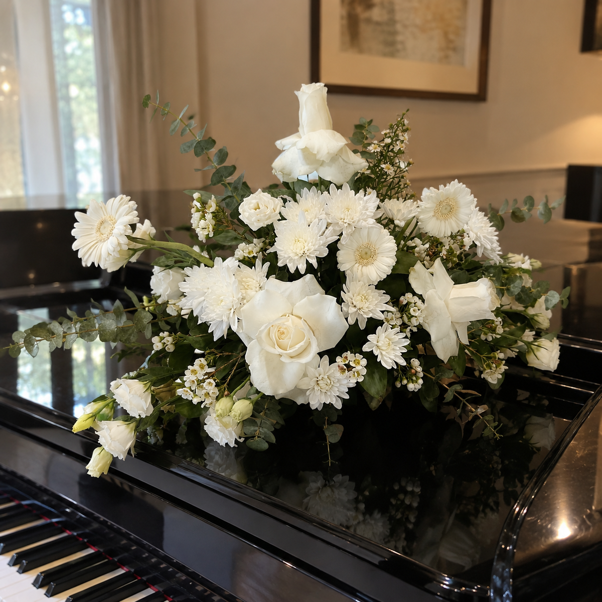 White floral arrangement displayed on a piano