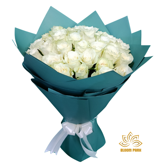Bouquet of white roses wrapped in teal paper fresh flowers delivery Dubai